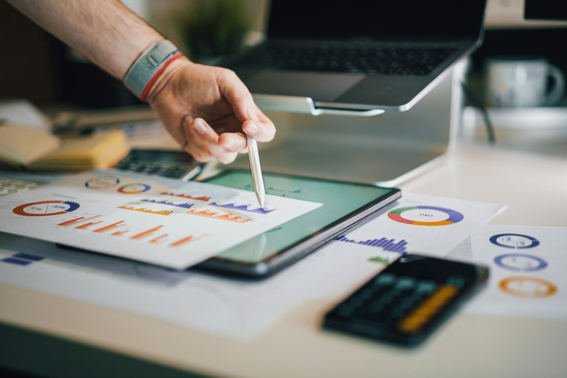 A business professional reviewing planning charts